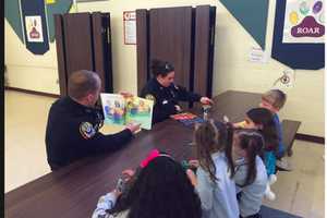 Bethel Police Officers Share Stories With Kids On Story Time Night
