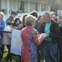 <p>Hillary Clinton signs an autograph as she meets a large crowd of supporters after casting her presidential primary ballot in Chappaqua.</p>