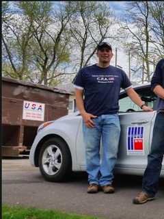 Members Of Newtown Police Department Prepare To Rebuild Veteran's Home