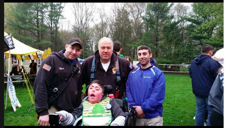 Members of the Monroe Volunteer Fire Department, No.1 Inc. and Anthony at his 15th birthday part celebration