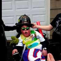 <p>Anthony is dressed up as a fireman at his 15th birthday party celebration in Monroe.</p>