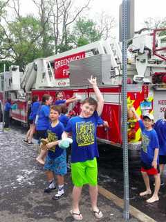 Fifth-Graders Dive In To Help Scrub Greenwich Fire Trucks