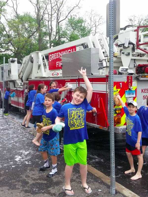 Fifth-Graders Dive In To Help Scrub Greenwich Fire Trucks
