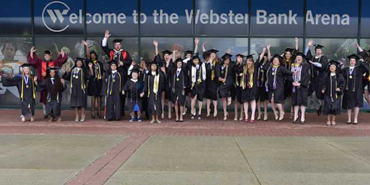 Graduates of Western Connecticut State University celebrate receiving their diplomas on Sunday, May 22.