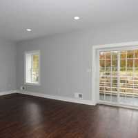 <p>The home has hardwood floors and access to the patio.</p>