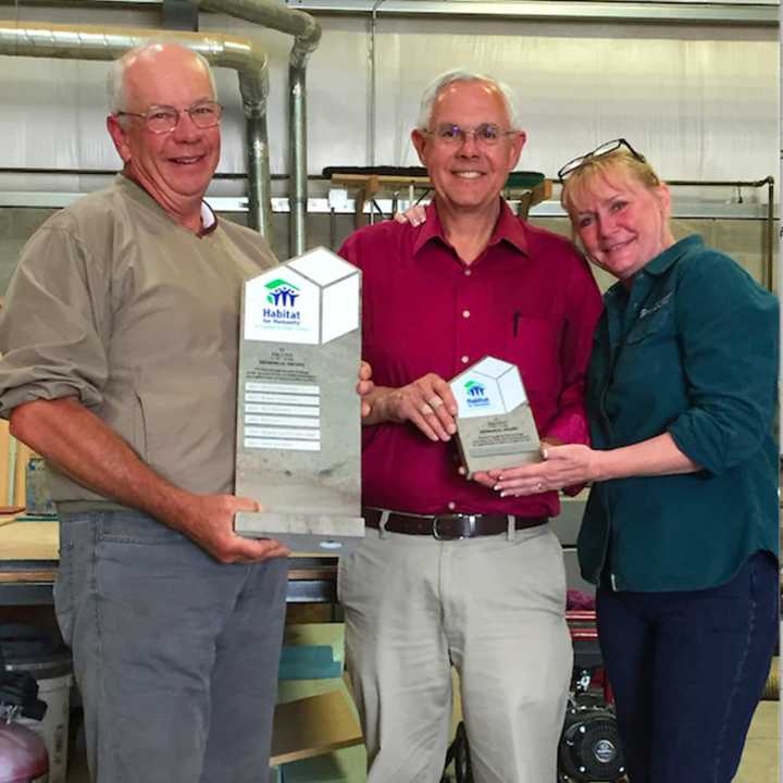 Habitat for Humanity of Coastal Fairfield County (Habitat CFC) honored Mize Johnson, center, at its recent annual Volunteer Recognition Event. He is flanked by Frank and Eileen Bakos.