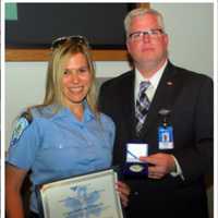 <p>From left, Paramedic Leigh Goodman and EMS Coordinator Wes Young. Goodman and Young were recognized by Bridgeport Hospital with “Certificates of Excellence” for their outstanding performance helping a man with severe burns to his airway.</p>