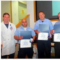 <p>From left, Dr Latham, Paramedic David Rodriguez, Lt. John Roberts, EMT Ralph Arnone and EMS Coordinator Wes Young were recognized for saving the life of a 71-year-old female patient in cardiac arrest due to an airway obstruction.</p>