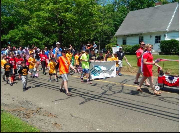 Many groups and clubs in Redding march in the town&#x27;s Memorial Day parade.