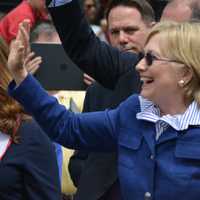 <p>Hillary Clinton waves as she marches in the town of New Castle&#x27;s 2016 Memorial Day parade, which went through downtown Chappaqua.</p>