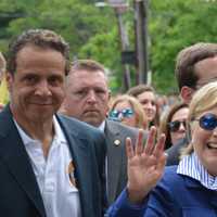 <p>Chappaqua&#x27;s Hillary Clinton waves as she marches in New Castle&#x27;s Memorial Day parade. Gov. Andrew Cuomo, who lives in the northern side of town, is pictured at left.</p>