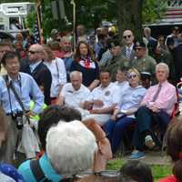 <p>Hillary and Bill Clinton are seated for the town of New Castle&#x27;s Memorial Day ceremony, which followed the annual parade in downtown Chappaqua.</p>