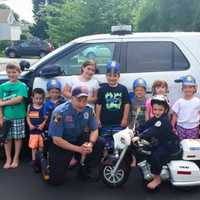 <p>Saddle Brook police officer Christopher Stanton surprised Andrew, 4, at his police-themed birthday party</p>