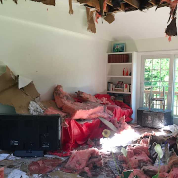 Damage from a fire that started after lightning struck a Thornridge Drive home in Stamford early Tuesday morning. Firefighters had to rip into the room&#x27;s ceiling in order to put the fire out.