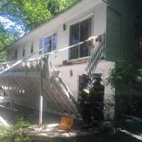 <p>Four people were injured Monday when this deck collapsed during a Fourth of July celebration.</p>