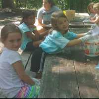 <p>Girls make tie-dye shirts at Camp Aspetuck in Weston.</p>