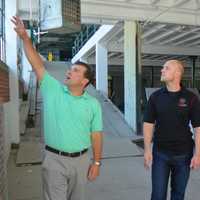 <p>State Rep. Steve Stafstrom, left, and P.J. Pitcher of Redline Restorations tour the comany&#x27;s new facility in Bridgeport.</p>