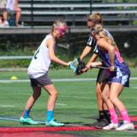 <p>An X-Treme Lax Factory athlete, left, faces an opponent at a June tournament.</p>