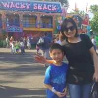 <p>Linda Weng with her 7-year-old son Matthew have been coming to the carnival for three years.</p>