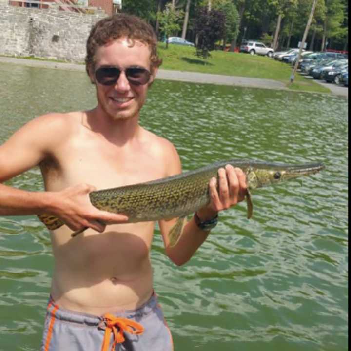 Schenectady&#x27;s Julian Canavan holds the Alligator Gar he caught before returning it to mother nature — even though it&#x27;s domesticated.