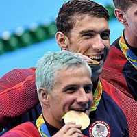 <p>Ryan Lochte (front) with rival Michael Phelps at the Olympics in Rio this week.</p>