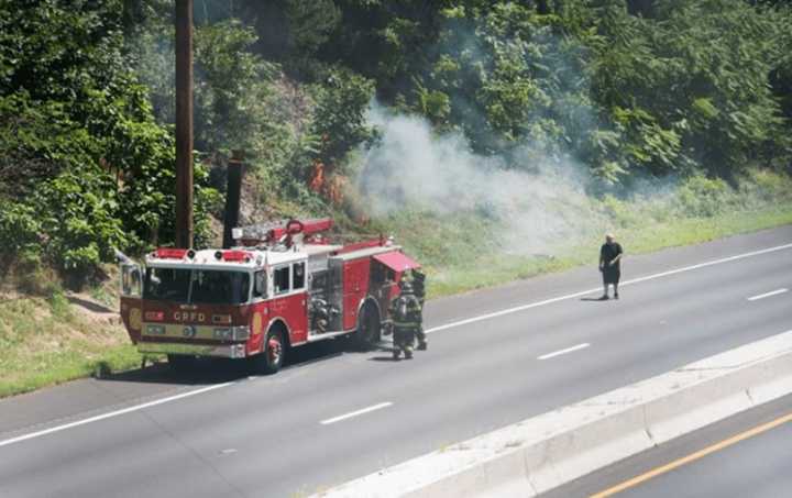 The GRFD extinguishes a brush fire Sunday.