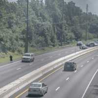 <p>Traffic backs up on Route 208 as officials prepare to extinguish a brush fire.</p>