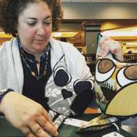 <p>Rutherford&#x27;s Rebecca Weiss displays the owl pillows she packs into Bob&#x27;s Boxes.</p>