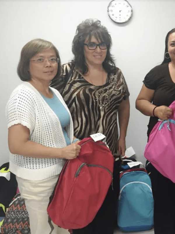 People’s Securities Stuffs Backpacks With School Supplies In Bridgeport