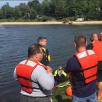 <p>Emergency responders at the scene in the search for a missing man at Sparkle Lake on Monday.</p>