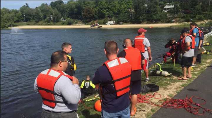 Emergency responders at the scene in the search for a missing man at Sparkle Lake on Monday.