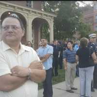 <p>About 100 people attend the Sept. 11 Memorial Remembrance Gathering on Friday at Elmwood Park in Danbury.</p>