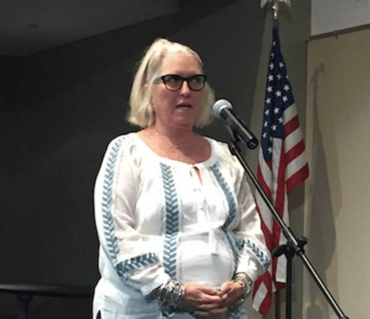 Terri Cronin of East Norwalk voicing her opposition to proposed Metro North fare hikes in a public hearing in Stamford on Wednesday.