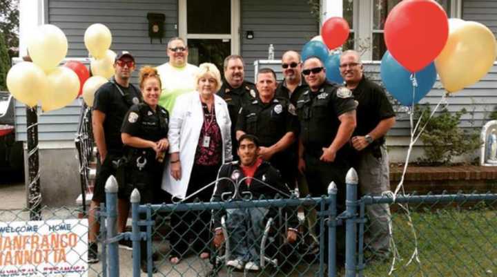 Gianfranco Iannotta and the Garfield Police Department after his escort home from Newark Airport Friday.