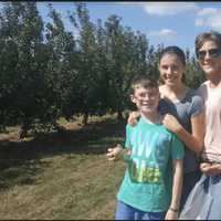 <p>Monroe resident Susan Napolitano with Maddy, 13, and Jackson, 10, at Blue Jay Orchards in Bethel</p>