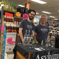 <p>Neil Doocy and Robert Schulten offer a taste of their wares at Mo&#x27;s Wine &amp; Spirits in Fairfield.</p>