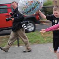 <p>Grace VanderWaal and her friends as they walk toward a stage for a reception.</p>