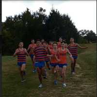 <p>Danbury High&#x27;s senior boys race in the last regular home meet of the cross country season on Tuesday at Tarrywile Park  Seniors raced in the Pat Healey team singlets.</p>