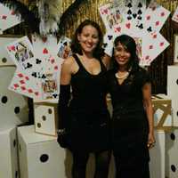 <p>Evannie Ramos, left, and Shehrina Tabassum of Leonia at as flappers during a speakeasy fundraiser they planned for a local school.</p>