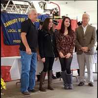 <p>Members of the Busse and Taubaum families received the Civilian Award for their actions during a motor vehicle accident at 130 King St. in Danbury.</p>