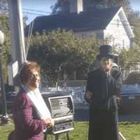 <p>From left, Bethel residents Gina Clarizio dressed up as Queen Isabella and Mike Mastroianni dressed as Christopher Columbus at the 35th annual Columbus Day celebration on Monday morning.</p>