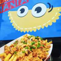 <p>Empanada Mania&#x27;s Buffalo Chicken and chicharron fries.</p>