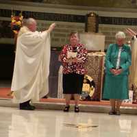 <p>Blauvelt Dominican Sisters Carol Carullo, left, and Dorothy Maxwell, right, renew their vows at their Golden Jubilee Liturgy.</p>