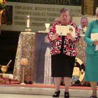 <p>Blauvelt Dominican Sisters Carol Carullo, left, and Dorothy Maxwell, right, renew their vows at their Golden Jubilee Liturgy.</p>