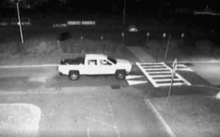 A still shot of the white Chevrolet Silverado pickup truck police are looking for.