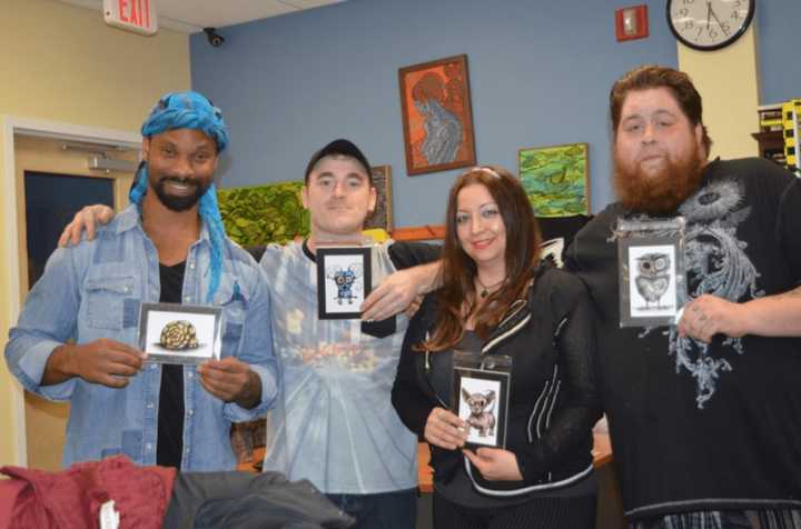 From left, Peter Duncanson, Jhonny Parks, Lara Skye and Ethan James, who are all holding up the character they play in the upcoming stop-motion film &quot;What The Mouse?&quot;