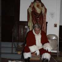 <p>Al DiGuido returning to street clothes after one of his Santa visits to children in Stamford.</p>