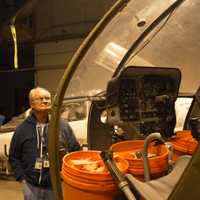 <p>Richie Jersey with a helicopter in the Connecticut Air and Space Center</p>