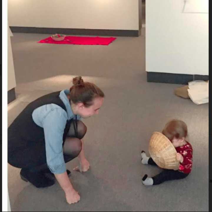 Kathleen Holko watches her daughter Maddie explore a basket at Bruce Beginnings, Jr.