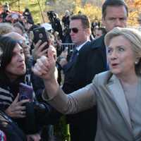 <p>Hillary Clinton gives a thumbs up while meeting with supporters and reporters after she cast her presidential vote in Chappaqua.</p>